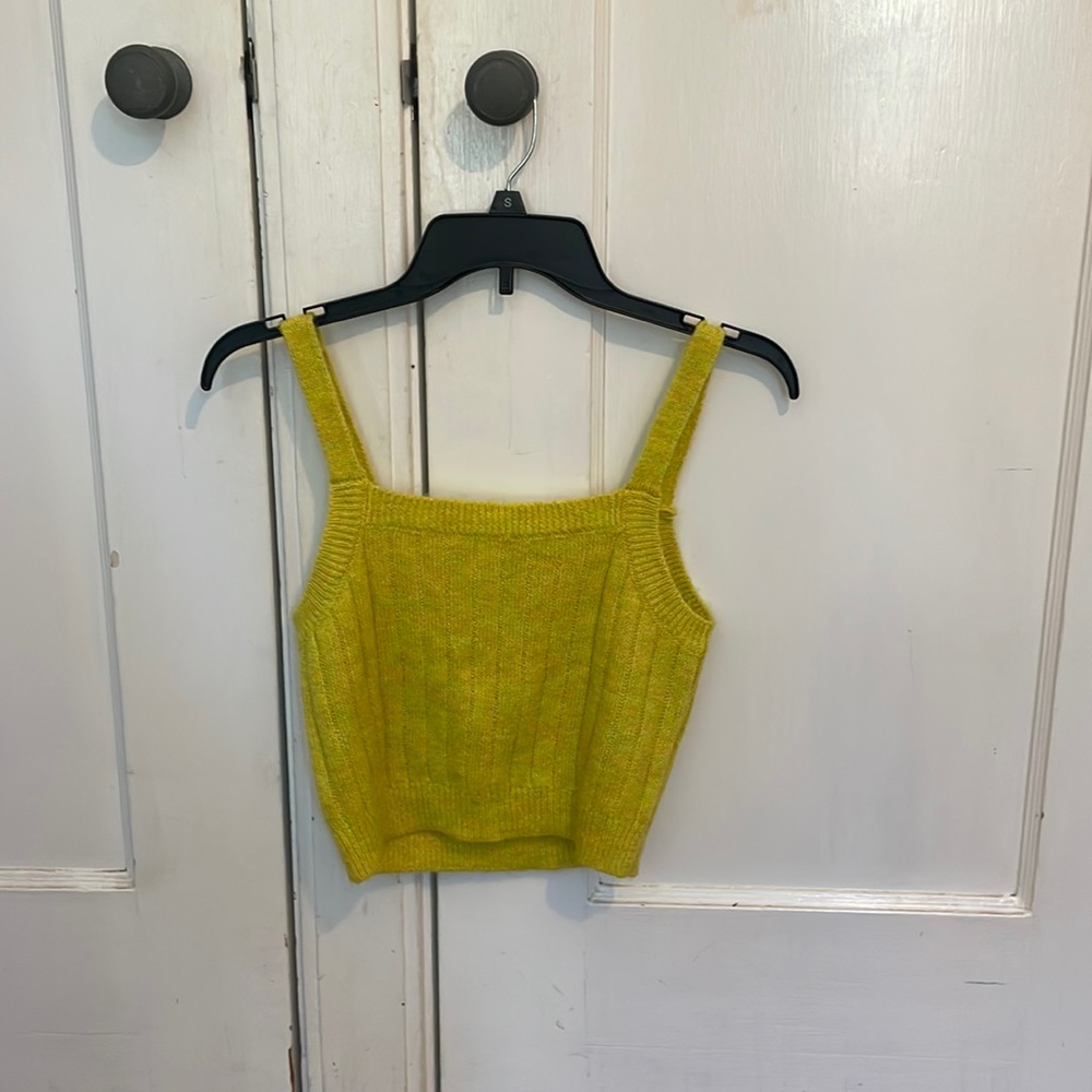 Loose fitting yellow with hints of green tank top.